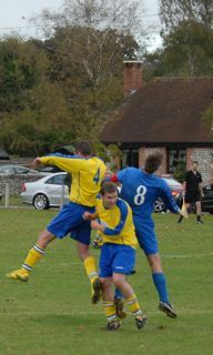 Tom parker and Dave Kennard in the thick of it LFC vs Cowfold